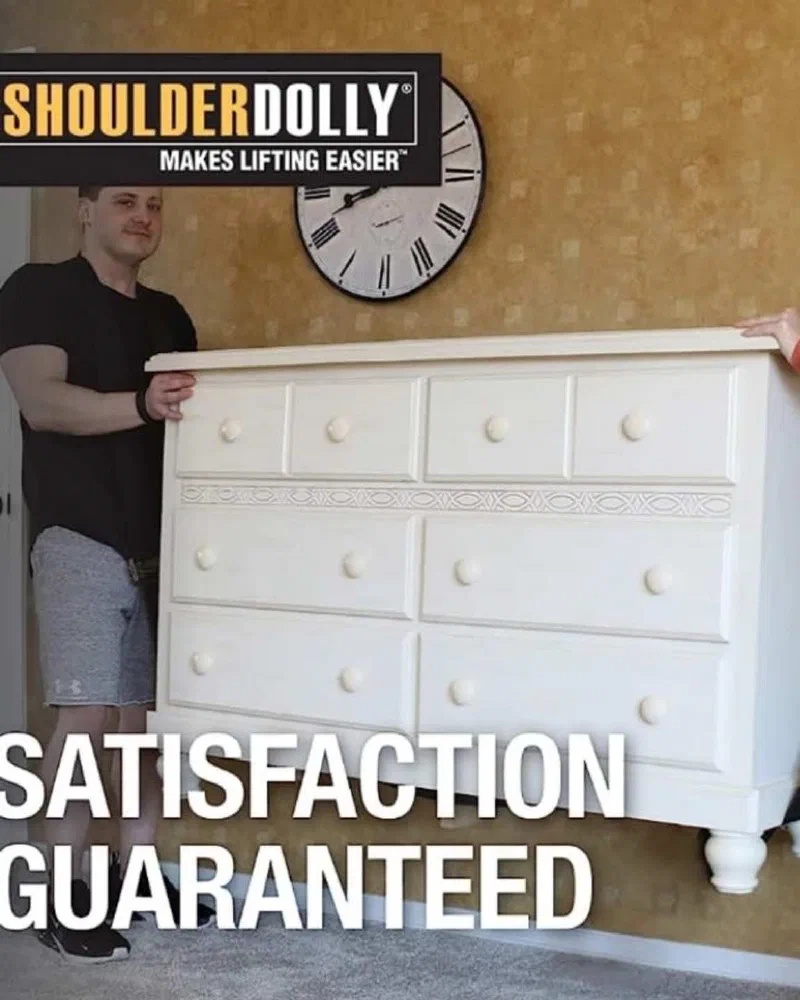 Ryan carefully moving a dresser